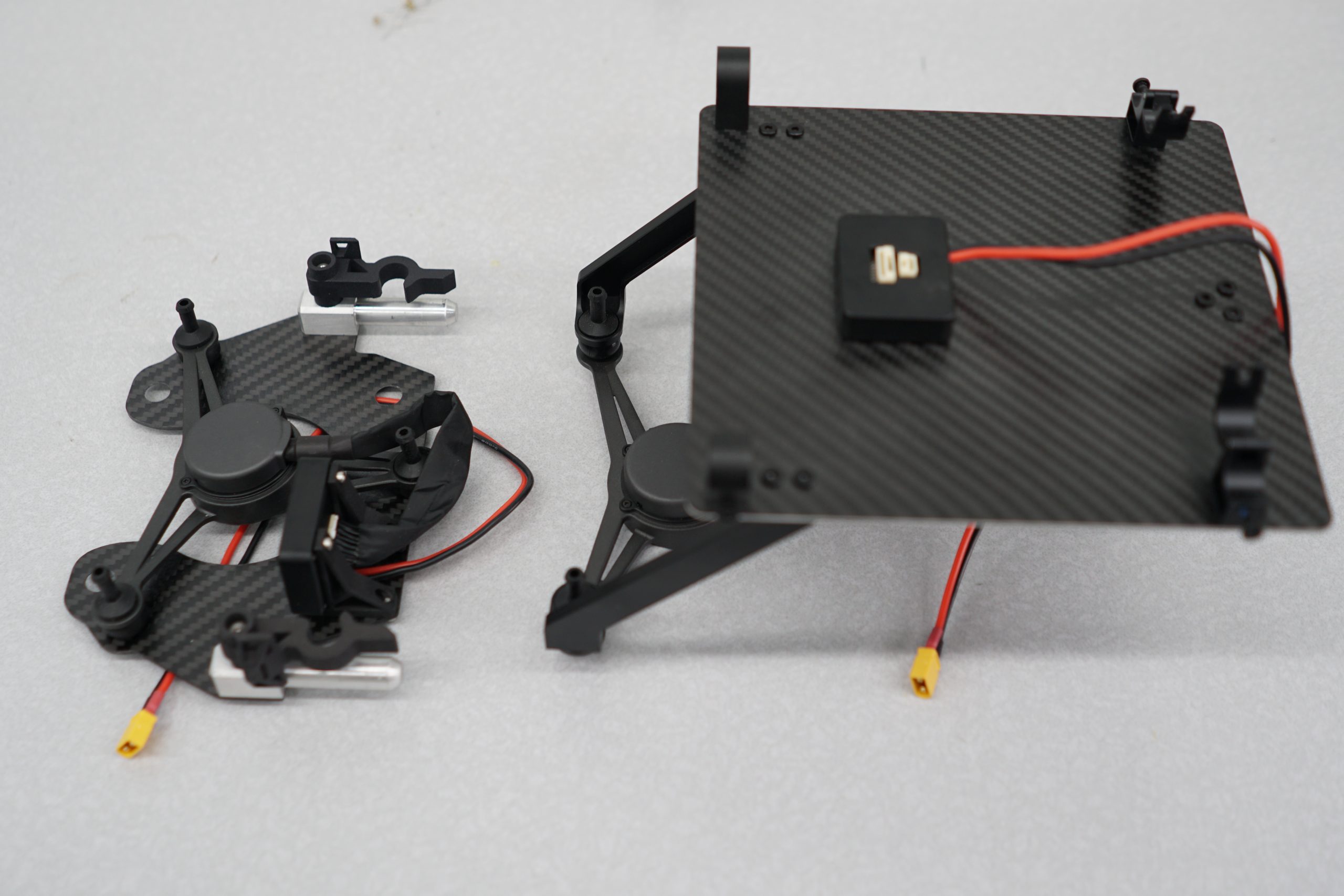 Drone Amplified Mount (left) and Stock DJI Mount (right)
